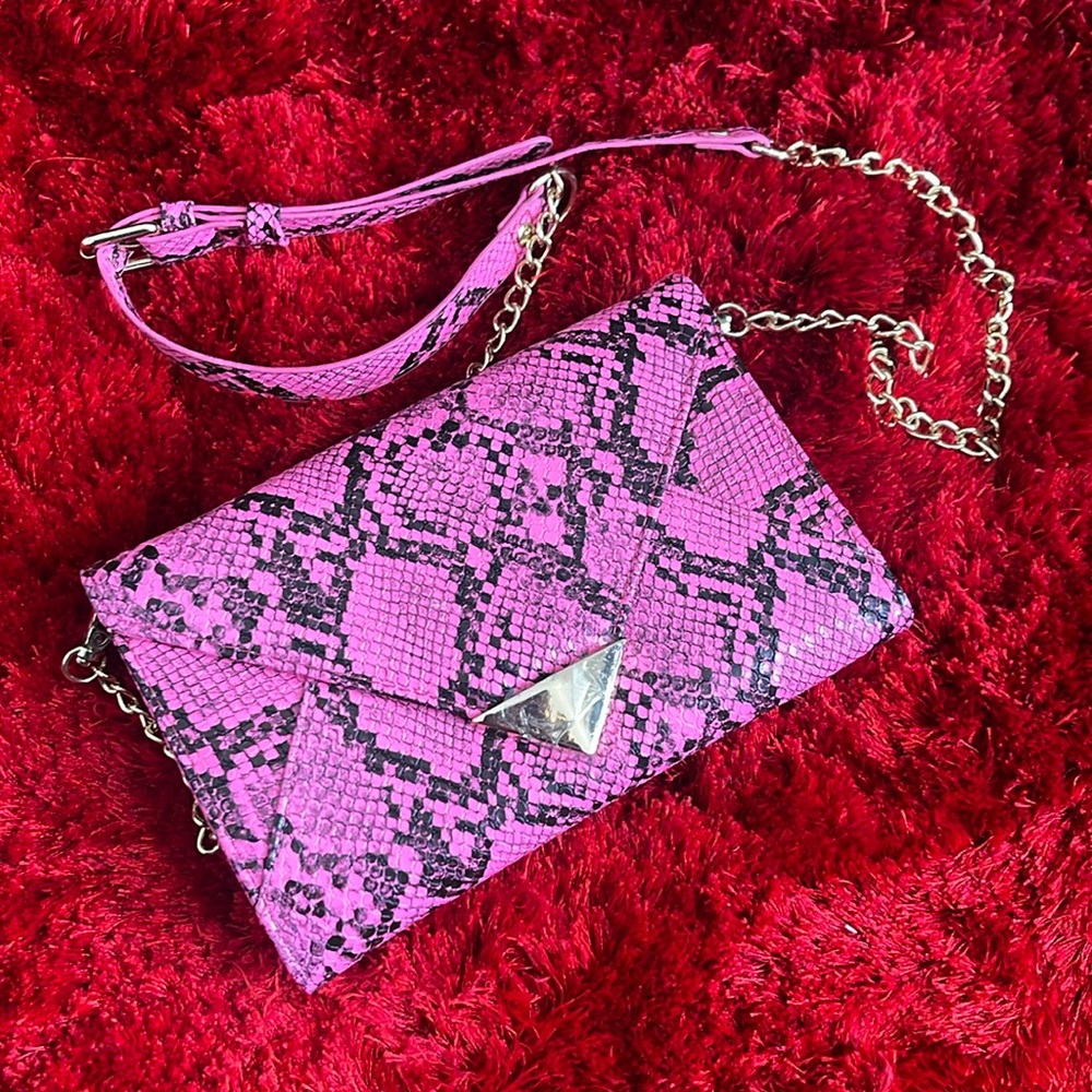 Pink and black snake print handbag
